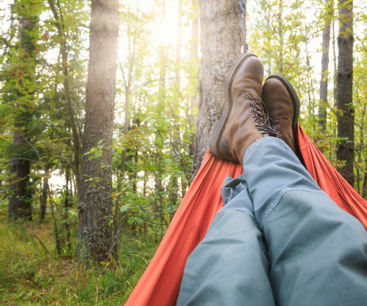 Man relaxing in a hammock.