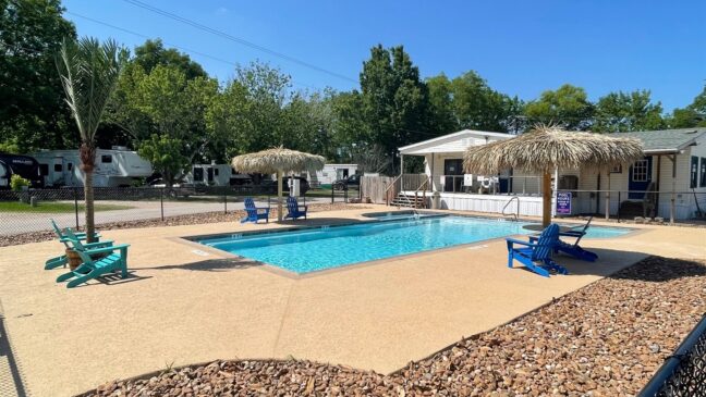 Communal pool with tiki overhead shade.