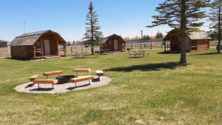 Rentable cabins and community fire pits at Laramie RV Resort