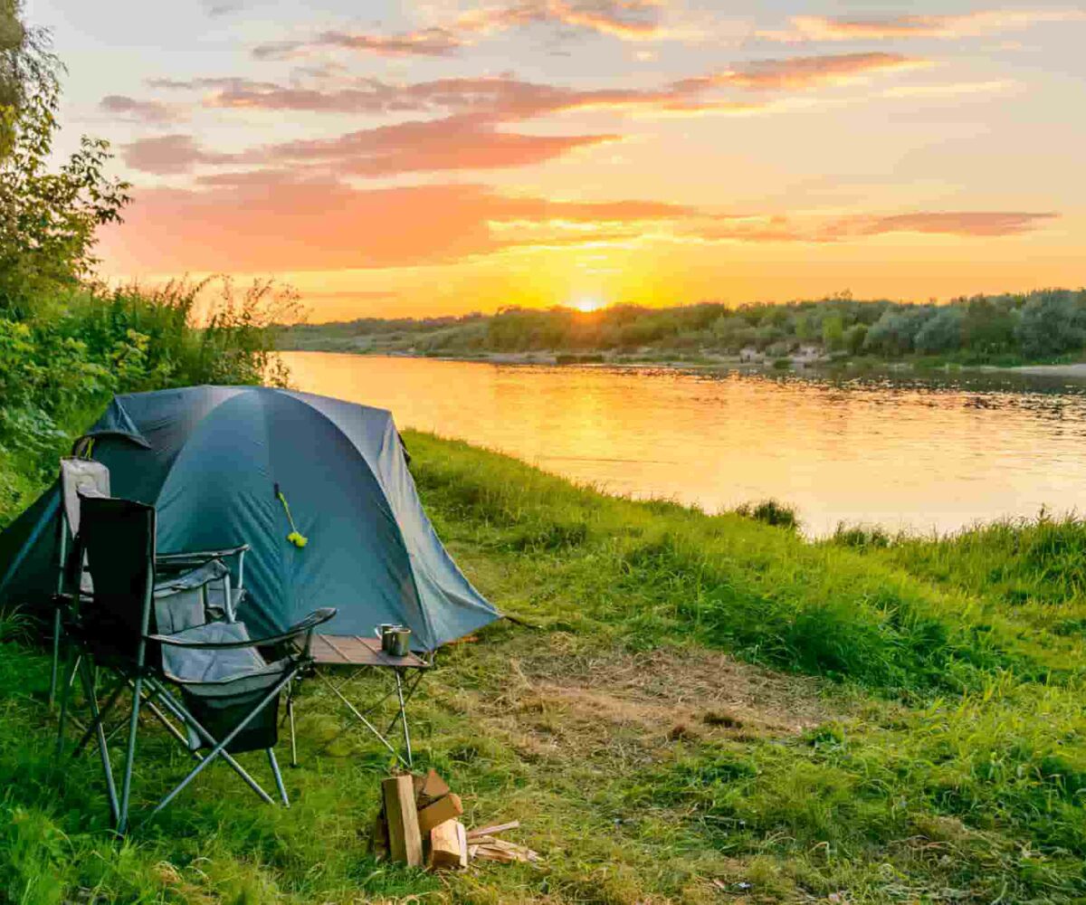 Campsite set up with the view of sunset on the lake