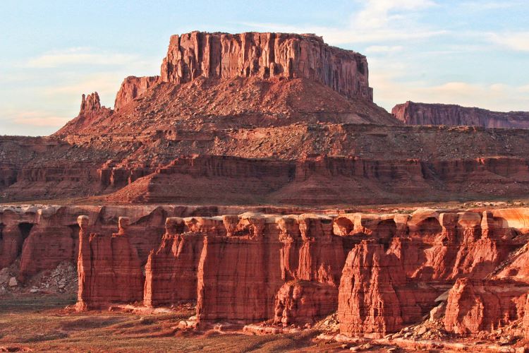 A view of a large rock formation and canyons at Canyonlands National Park in Utah.