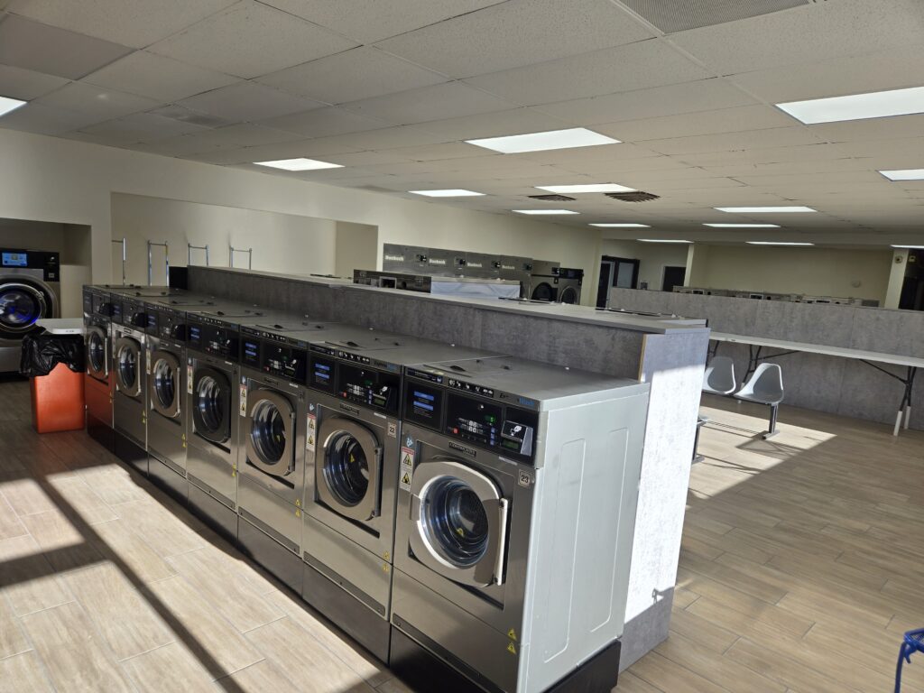 Rows of new washers and dryers inside Cedar City Laundromat after its 2026 remodel