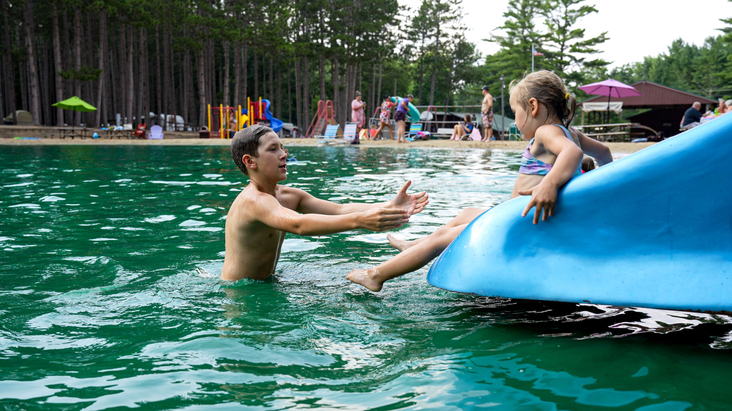 Swimmers in the pond at Pearl Lake RV Campground by RJourney