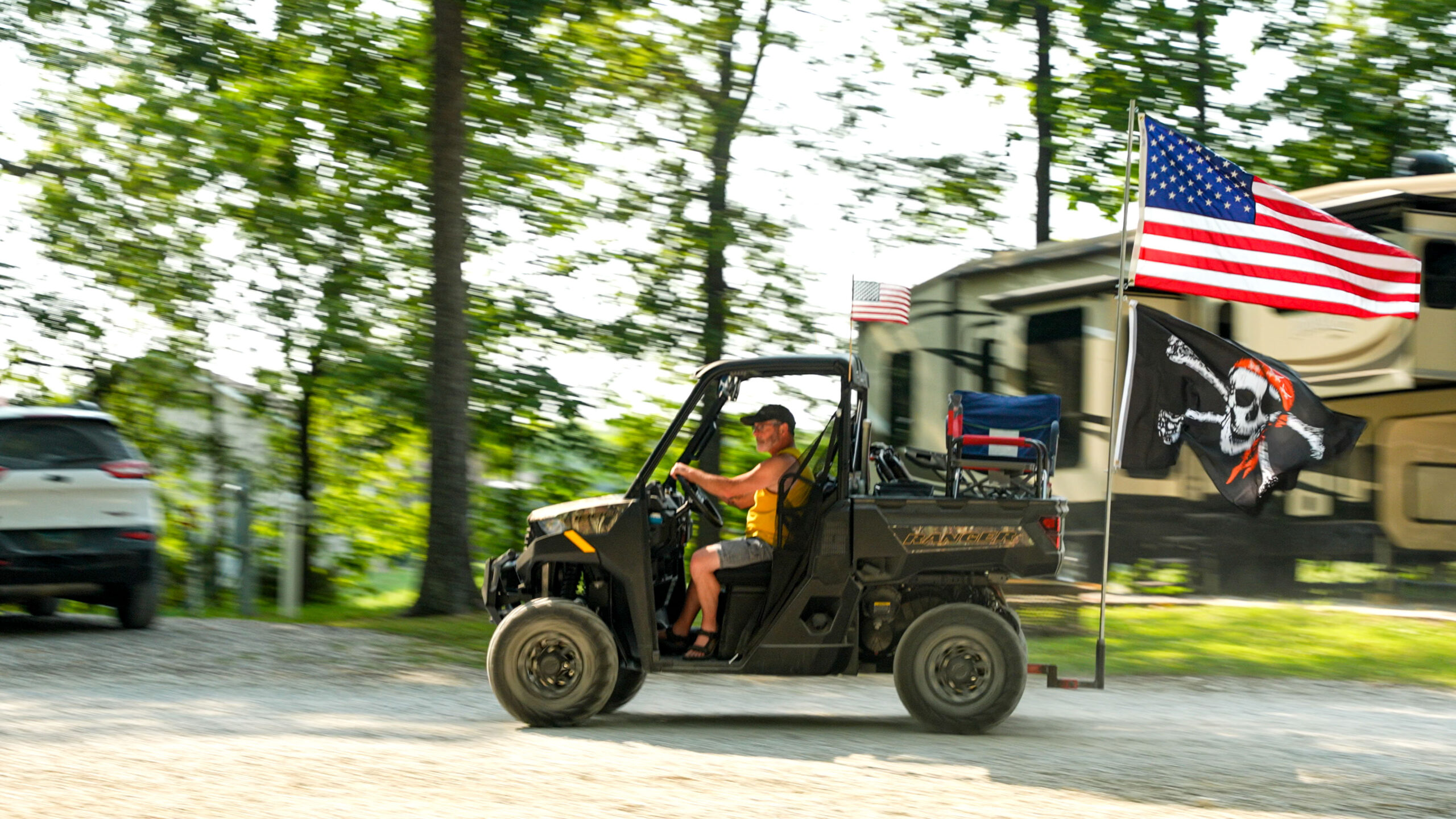 A guest at Perryville RV Resort by RJourney drives his ATV through Long-Term RV park near Perryville MO