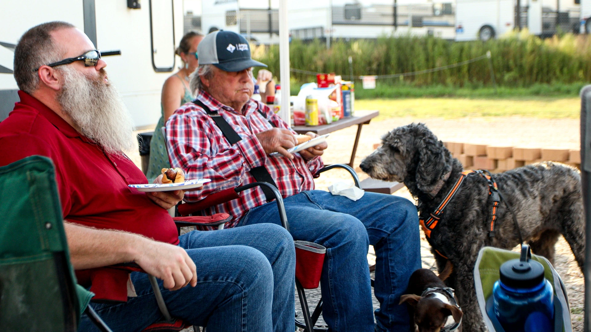 Campers and their dog eat dinner for some pet friendly camping at RJourney