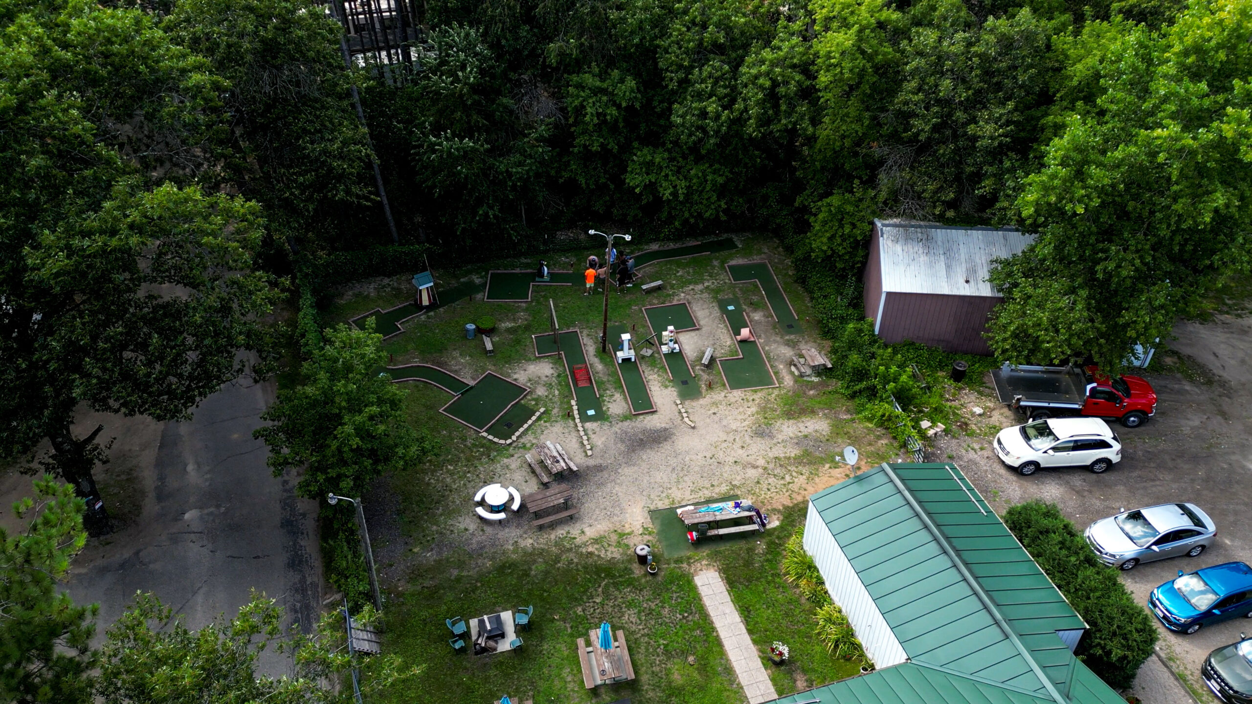 Aerial View of Pear Lake RV Resort, one of the best campgrounds near redgranite wi, showing mature forest and a wholesome atmosphere.
