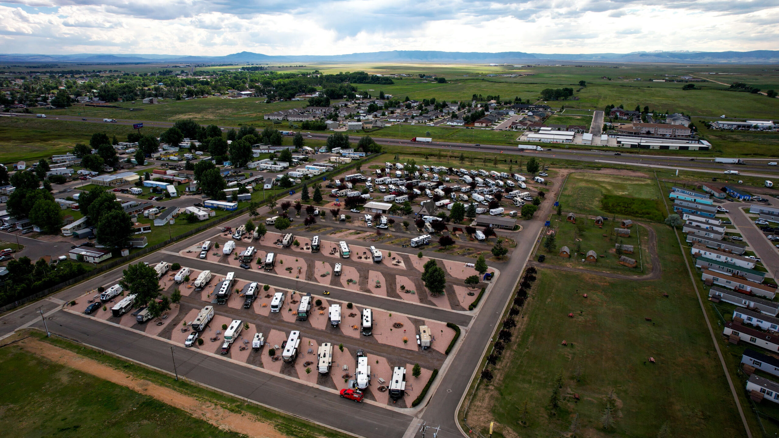 Pull-through RV sites with concrete pads at Laramie RV Resort by RJourney along Interstate 80 in Laramie, Wyoming