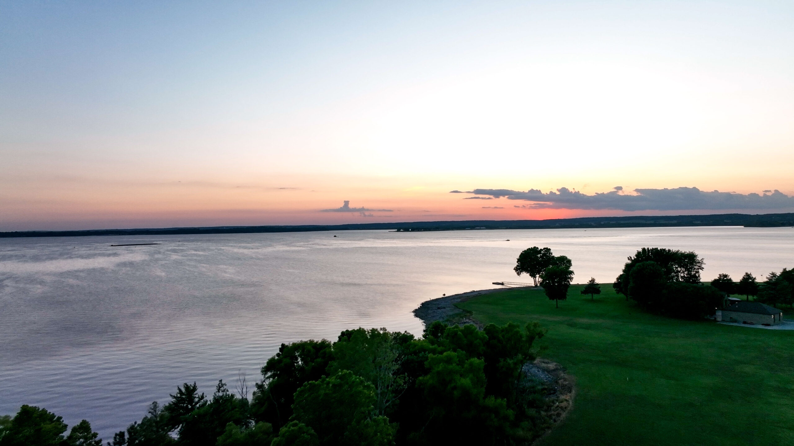 A sunset over one of the best campgrounds near Grove, OK; Grand Lake O' The Cherokees RV Resort by RJourney