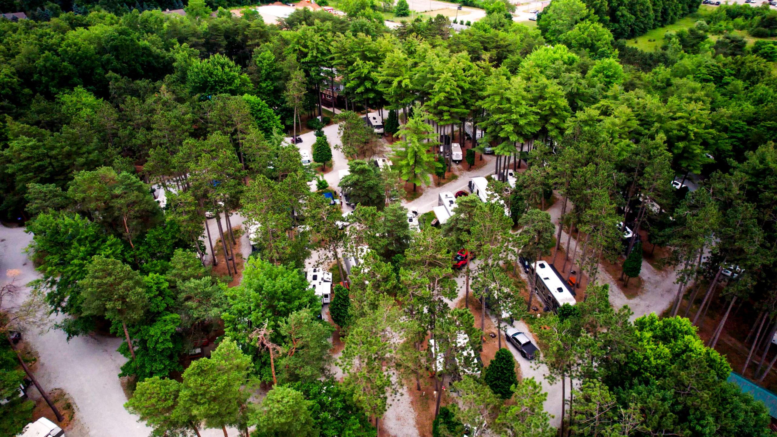 Aerial View of Elkhart RV Resort with mature trees.