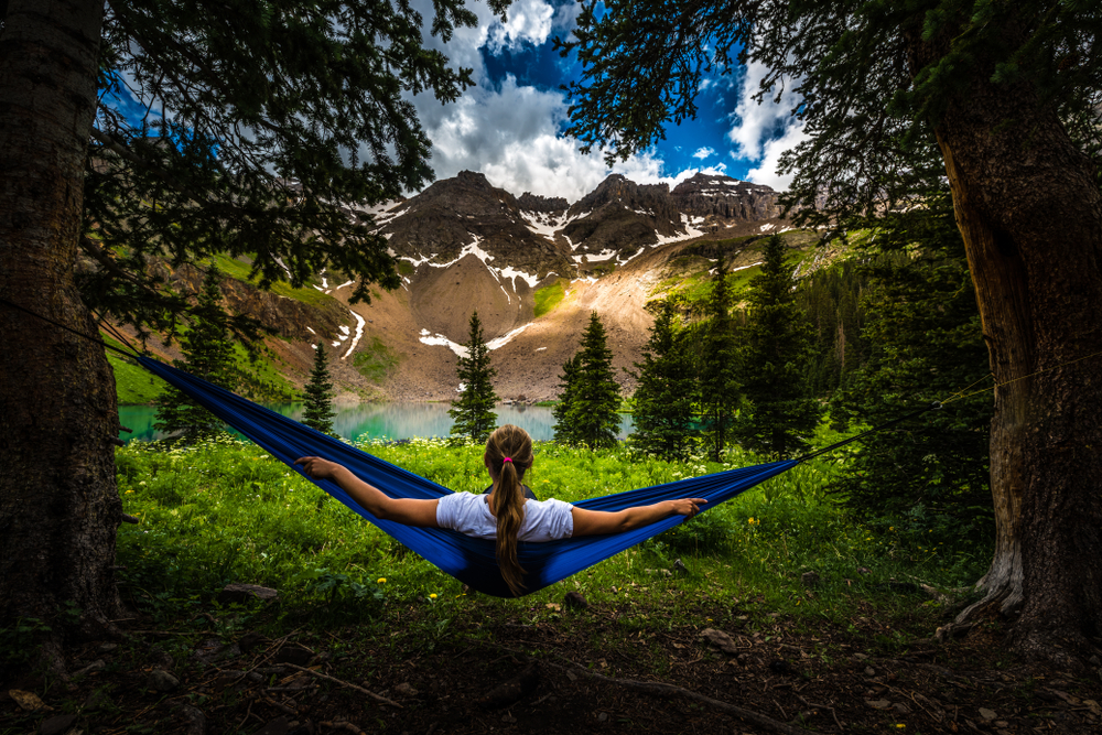 Girl rests on a Hammock near Lower Blue Lake Ridgway Colorado USA