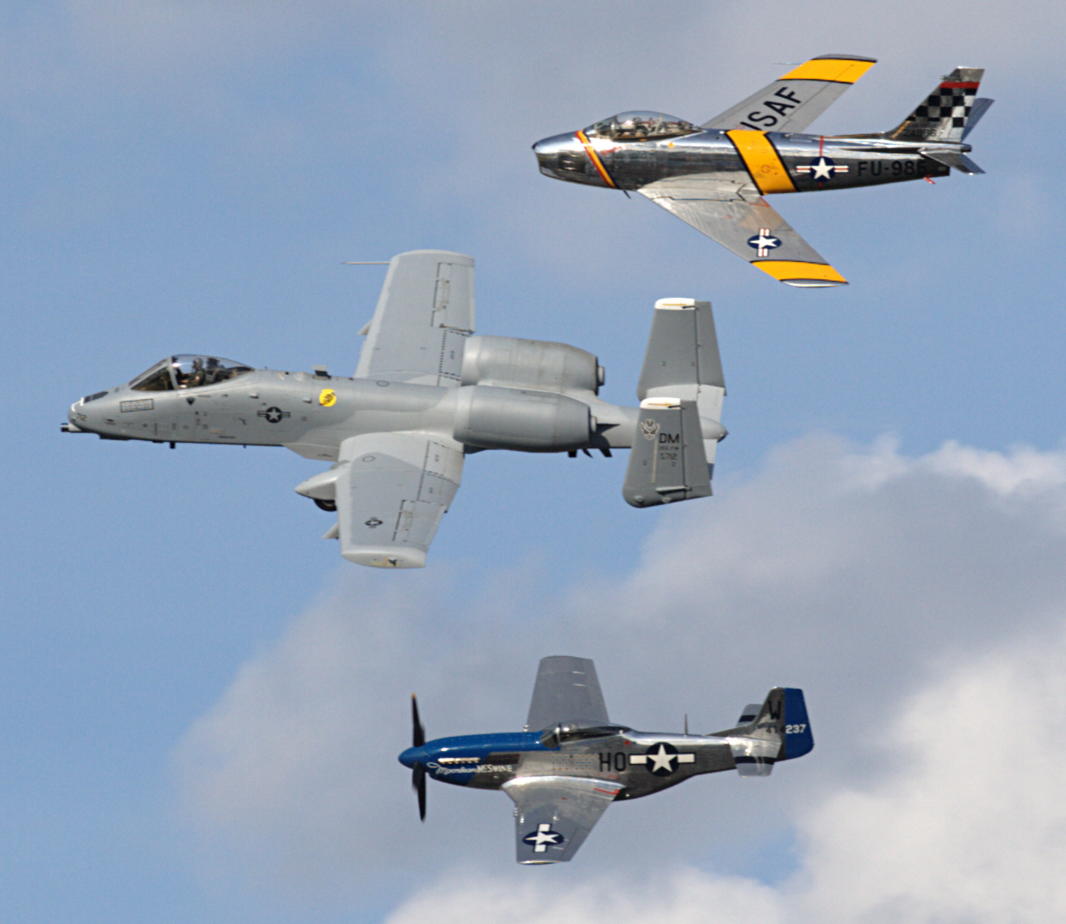 Heritage Flight formation of an F-86 Sabre, A-10 Thunderbolt, and P-51 Mustang at EAA AirVenture Oshkosh