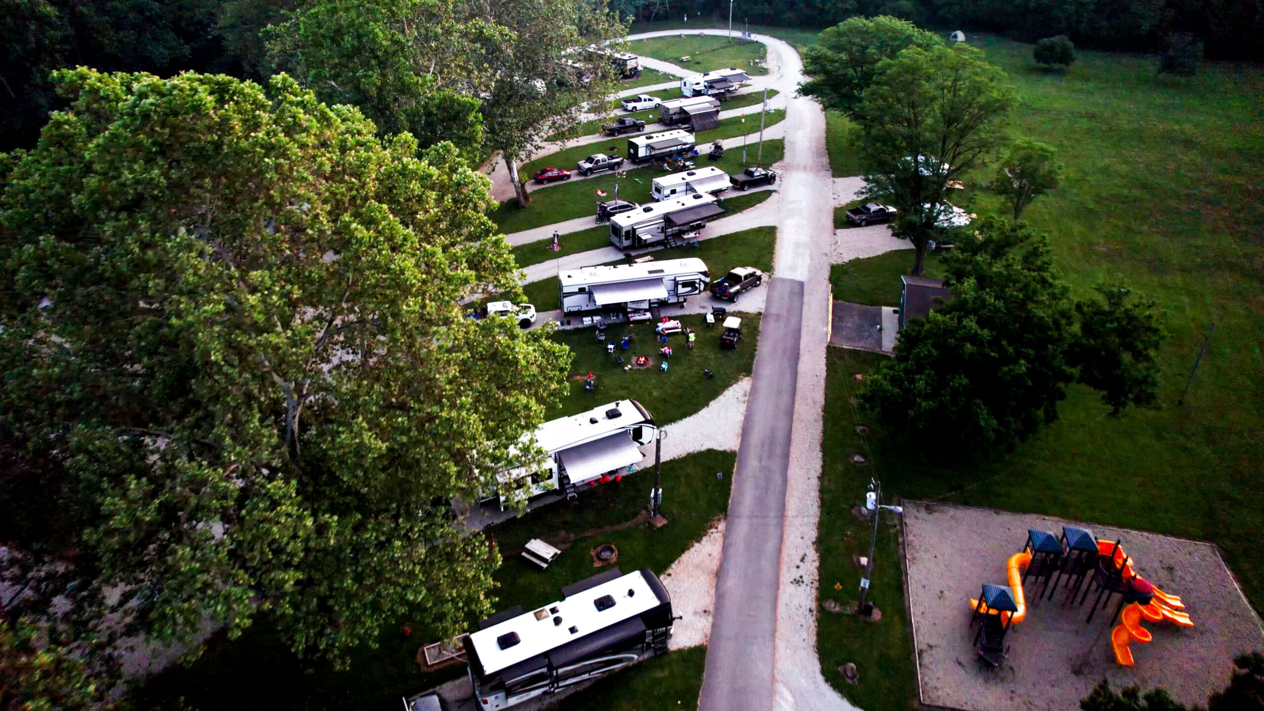 Aerial view of Muncie RV Resort by RJourney showing RV sites along the White River, the swimmable lake, and the private island near Anderson, Indianar Anderson Indiana