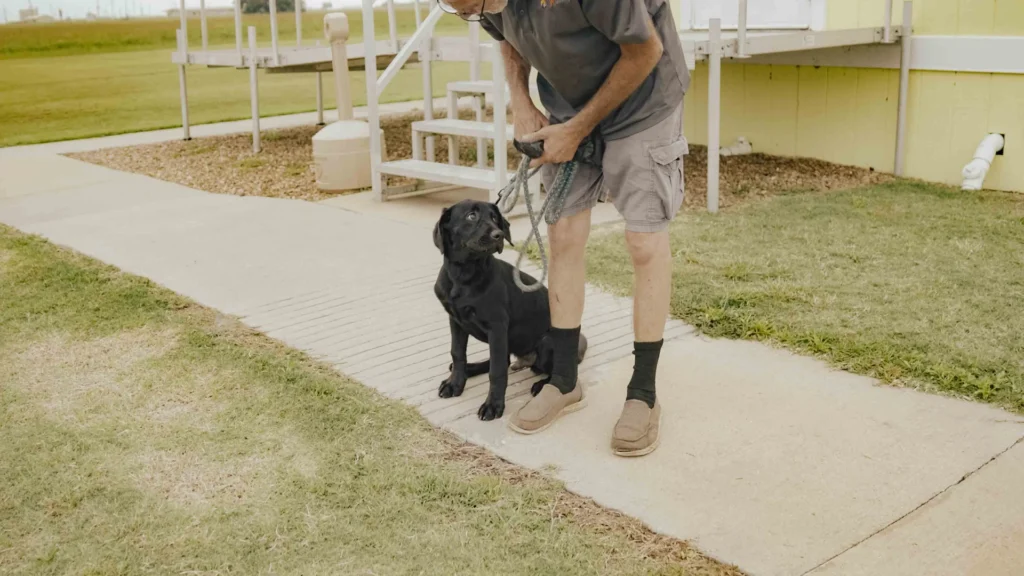 A man and his dog at Lake Charles RV Park by RJourney