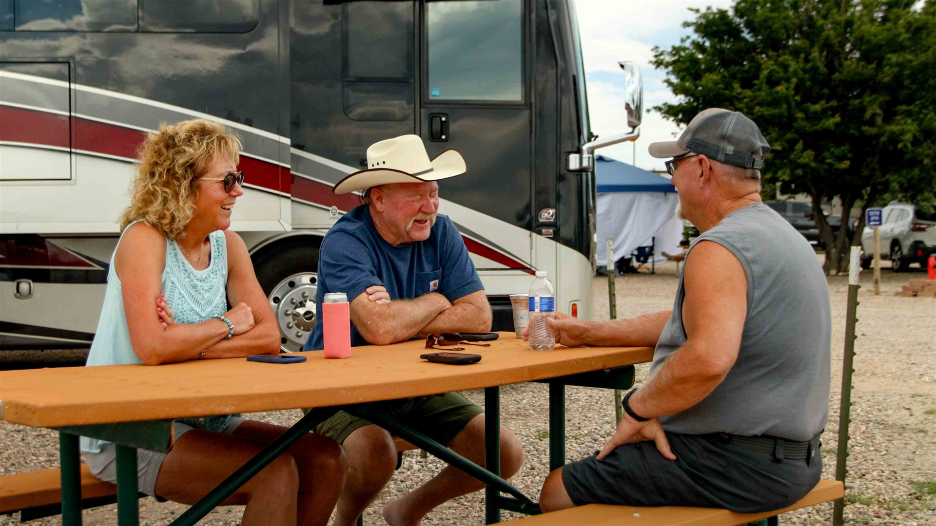 Tent and RV campsites with picnic tables and open prairie at Cheyenne RV Resort in Cheyenne, Wyoming