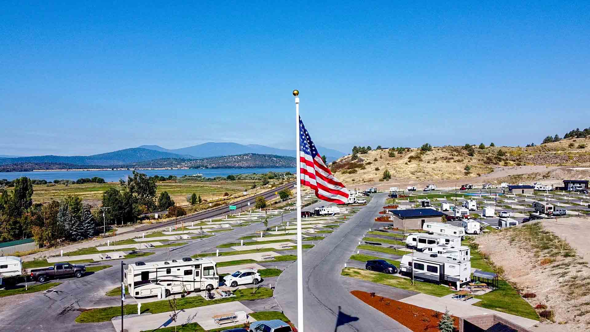 Pull-through RV sites with concrete pads and Upper Klamath Lake views at Klamath Falls RV Resort, Oregon