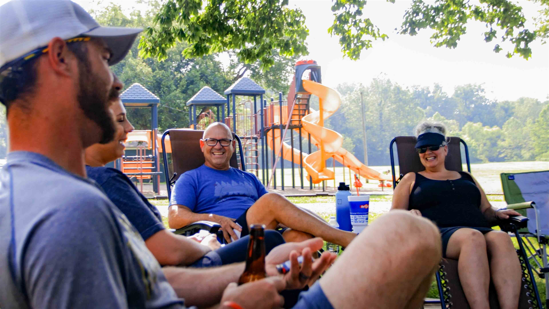 Pull-through RV sites along the White River at Muncie RV Resort by RJourney near Anderson, Indiana