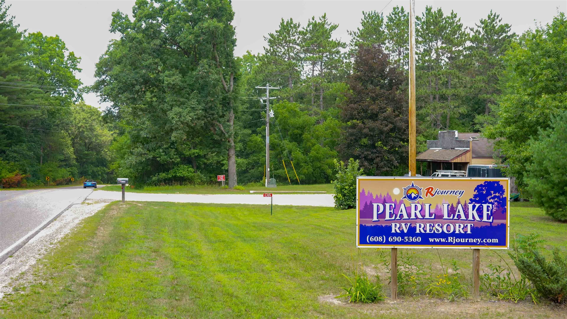 Full hookup campsites under red pines at Pearl Lake RV Campground in Redgranite, Wisconsin
