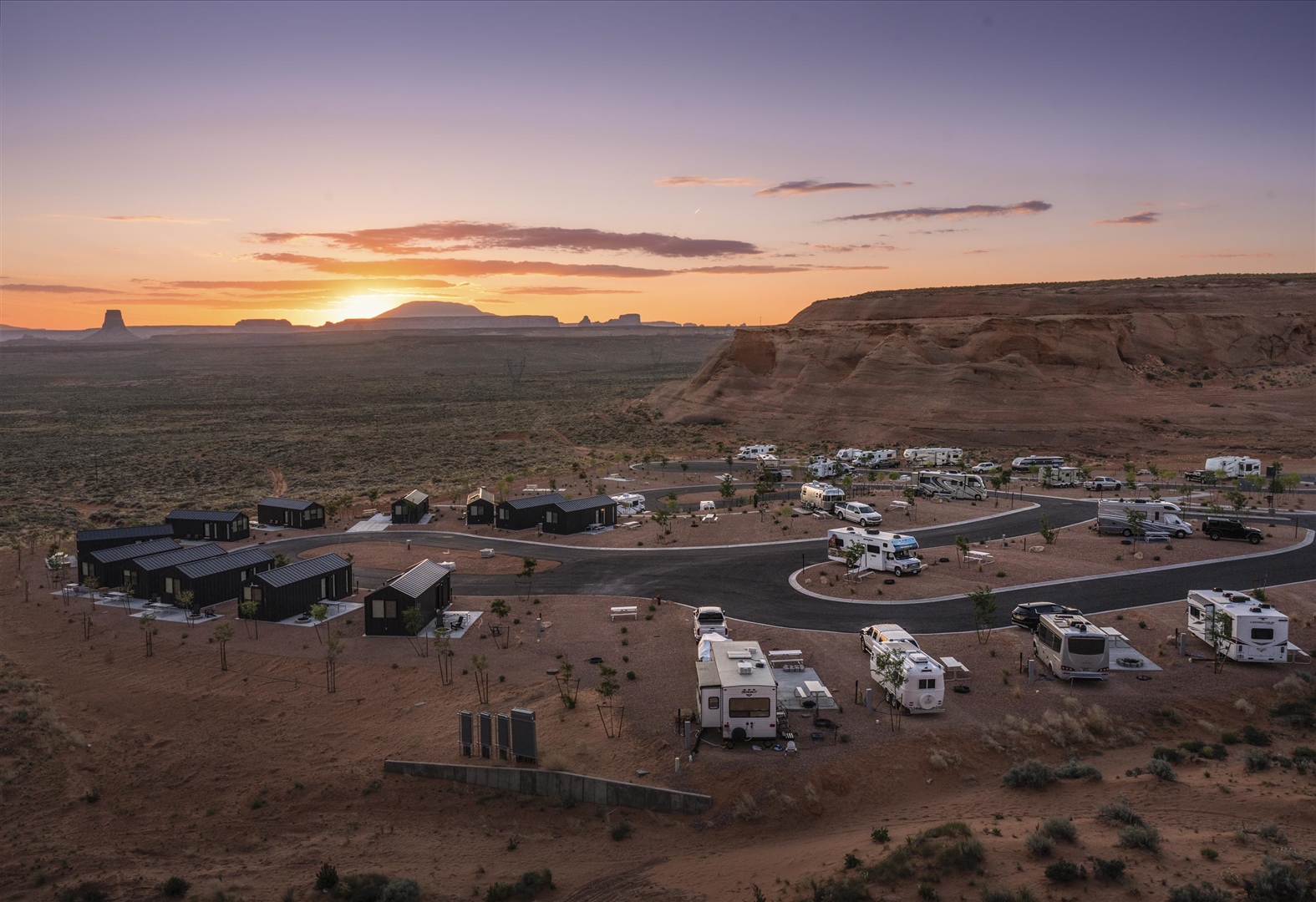 Full-hookup RV sites with desert red rock backdrop at Roam Horseshoe Bend RV Resort in Page, Arizona