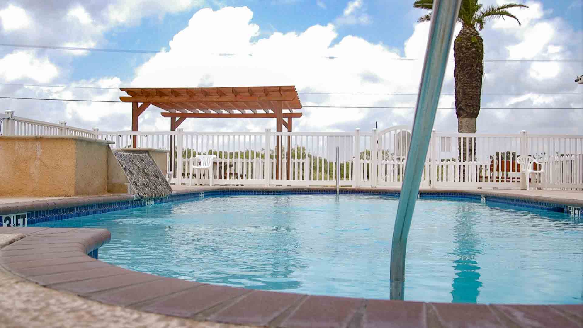 Full hookup RV sites on concrete pads built for long-term stays at Rockport RV Resort in Rockport, Texas